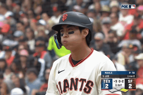 Baseball Player in Giants Jersey Looking at Scoreboard