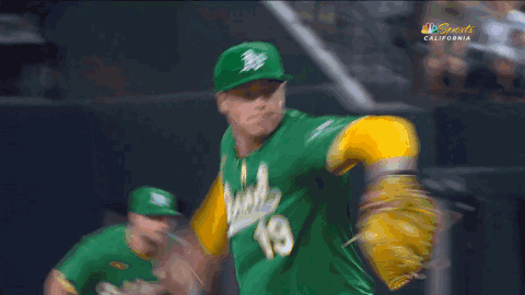 Baseball Player in Green Jersey Number 9
