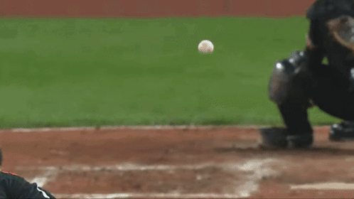 Baseball Player in Green Shirt with M