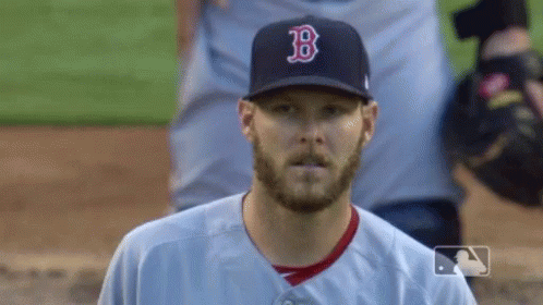 Baseball Player in Hat With Letter B Looking at Camera
