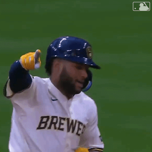 Baseball Player in Helmet and Gloves Giving Thumbs Up