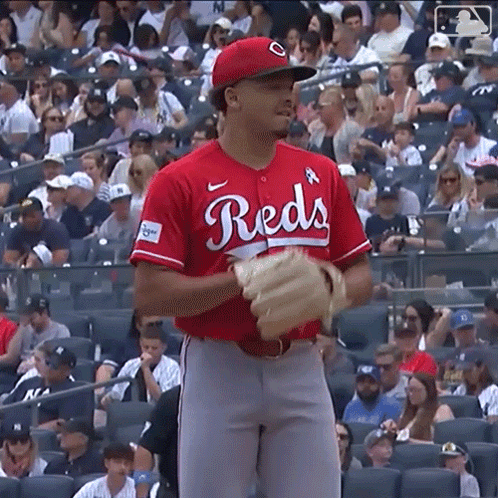 Baseball Player In Helmet And Gloves On Field GIF