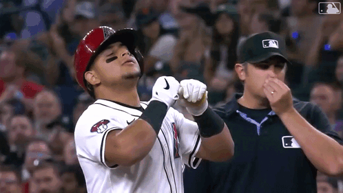 Baseball Player In Helmet And Nike Gloves Facing Referee GIF