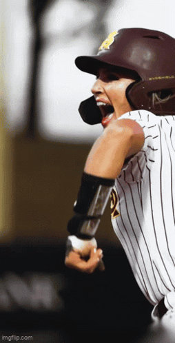 Baseball Player in Helmet and Striped Shirt Number 5