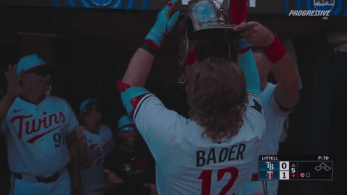 Baseball Player in Helmet Bader 12 Jersey