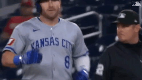 Baseball Player in Kansas City Uniform Walking Towards Referee