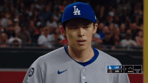 Baseball Player in LA Hat Looking Down