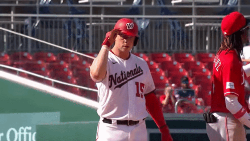 Baseball Player in LA Jersey Standing in Outfield