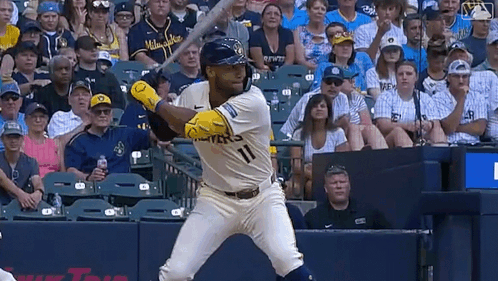Baseball Player In Milwaukee Jersey Swinging Bat GIF
