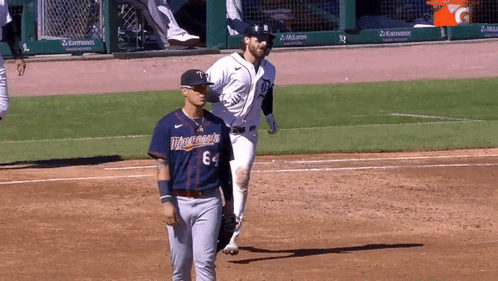 Baseball Player in Minnesota Jersey Walking Across Field