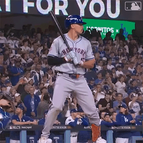 Baseball Player in New York Jersey Holding Bat