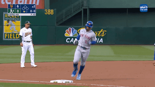 Baseball Player in New York Mets Jersey Running to First Base
