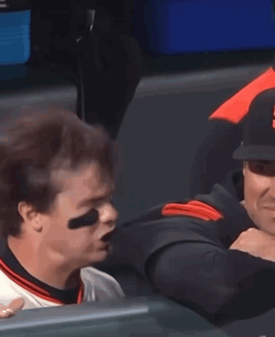 Baseball Player in Nike Jersey Sitting