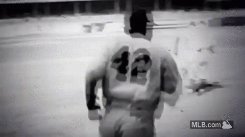 Baseball Player in Number 42 Jersey Running