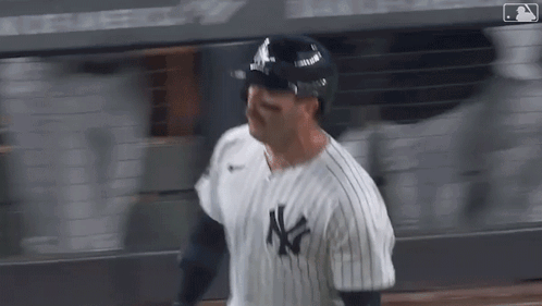 Baseball Player in NY Yankees Uniform and Helmet