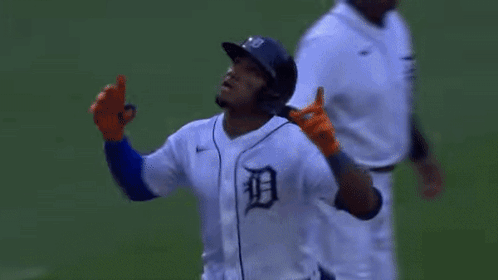 Baseball Player in Orange Gloves and Helmet Running