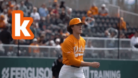 Baseball Player in Orange Jersey With Letter K