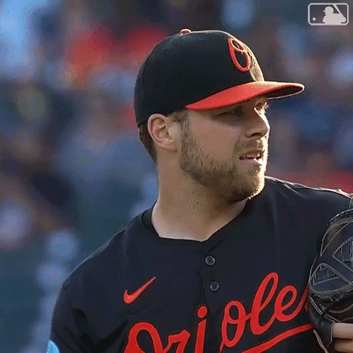 Baseball Player in Orioles Jersey Looking Left
