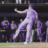Baseball Player in Purple Uniform Number 18