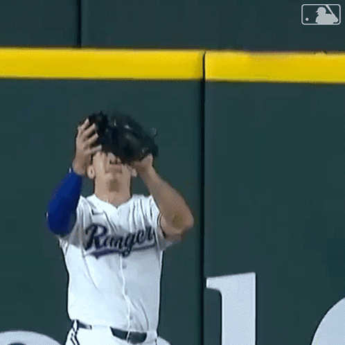 Baseball Player In Rangers Uniform Catching Ball GIF