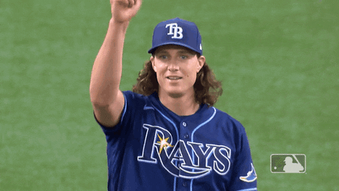 Baseball Player in Rays Jersey Holding Up Fist
