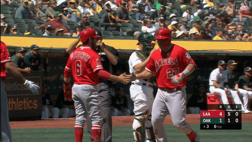 Baseball Player in Red Angels Jersey Shaking Hands