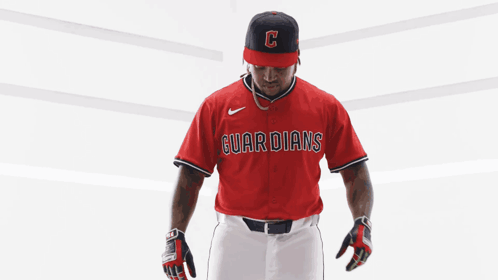 Baseball Player in Red Guardians Jersey