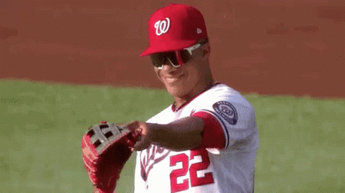 Baseball Player in Red Hat and Sunglasses