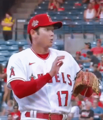 Baseball Player in Red Hat and White Jersey