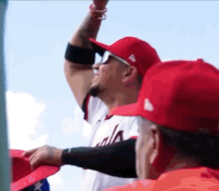Baseball Player in Red Hat Cheers