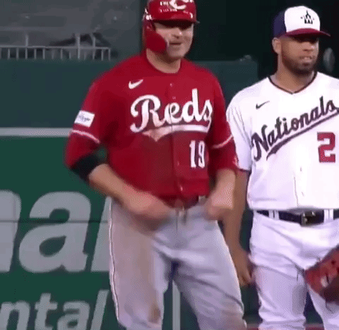 Baseball Player in Red Jersey Next to Player in White Jersey