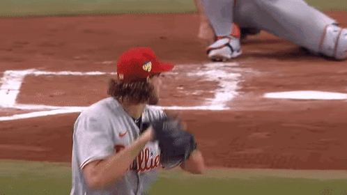 Baseball Player in Red Phillies Hat