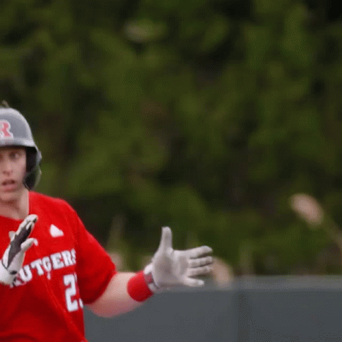 Baseball Player in Red Rutgers Jersey Number 23