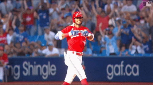 Baseball Player in Red Uniform Running Past Shingle Sign