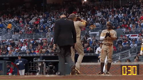 Baseball Player in San Diego Uniform Talking to Referee
