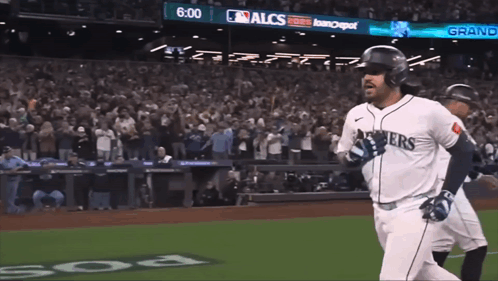 Baseball Player in Seahawks Jersey Running to Home Plate