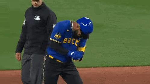 Baseball Player in Seattle Jersey Being Helped Off Field
