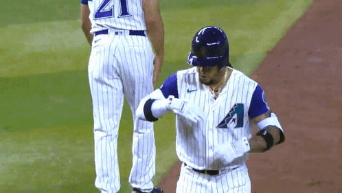 Baseball Player In White And Blue Uniform With Letter A GIF