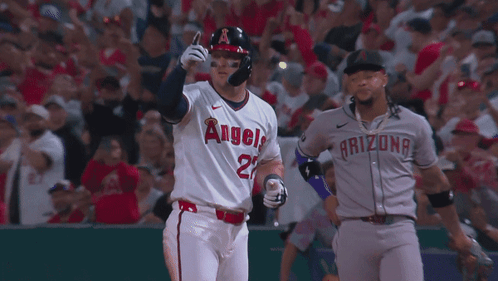 Baseball Player in White Angels Jersey Next to Arizona Player