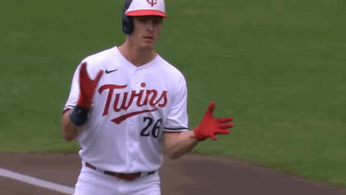 Baseball Player in White Jersey and Red Gloves Running