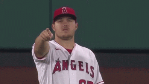 Baseball Player in White Jersey and Red Hat