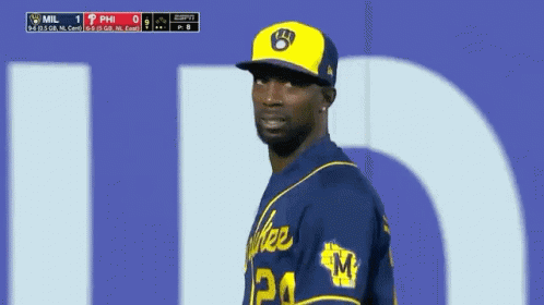 Baseball Player in Yellow Hat and Blue Jersey Number 24