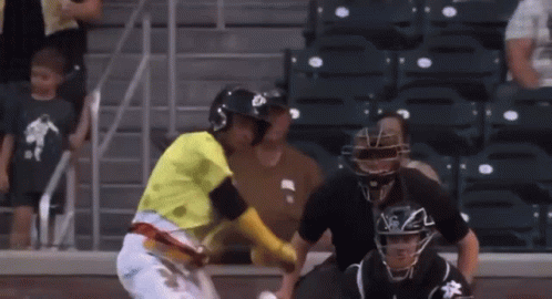 Baseball Player in Yellow NY Jersey