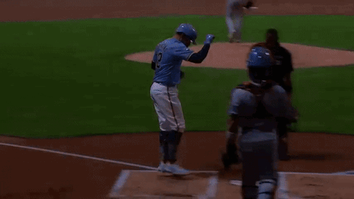 Baseball Player Jumping to Catch Ball