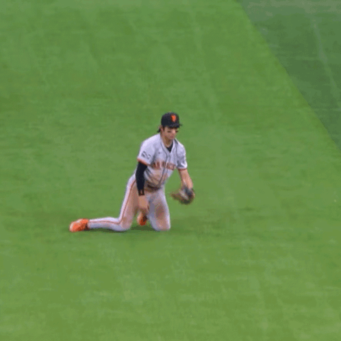 Baseball Player Kneeling in Giants Jersey