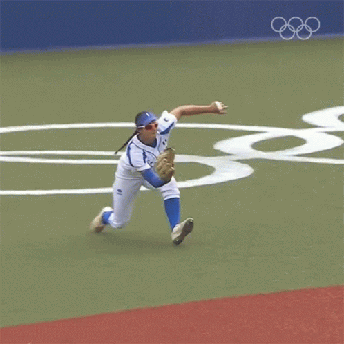 Baseball Player Laying on His Back Catching Ball