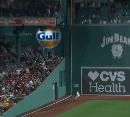Baseball Player Leaning Against Wall