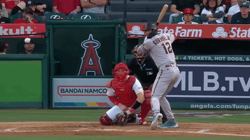 Baseball Player Number 12 Swinging At Pitch GIF