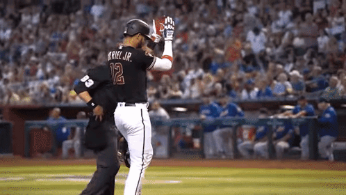 Baseball Player Number 12 Talking To Another Player GIF
