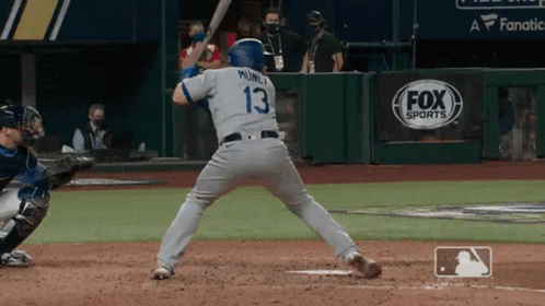 Baseball Player Number 13 Swinging Bat